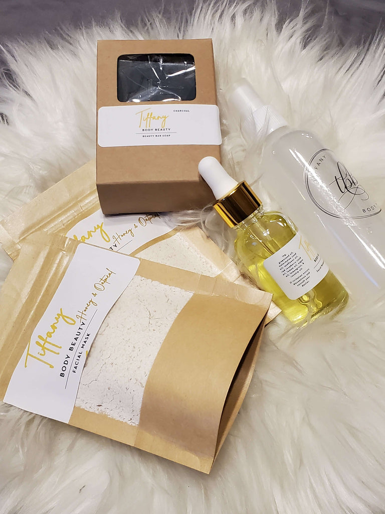 Tiffany body and beauty Platinum Bundle featuring bath products on a fluffy surface.